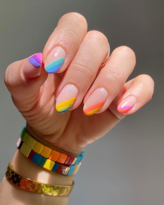 Rainbow asymmetrical tip manicure