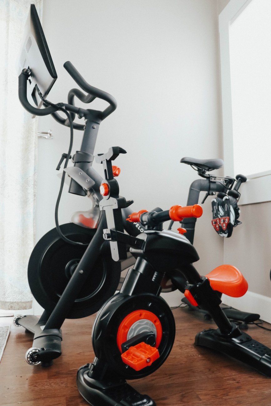Transformed the Fisher Price Think & Learn stationary bike to look like my Peloton bike. Sharing the DIY on my blog! #ditproject #peloton #minipelotonbike #fisherprice