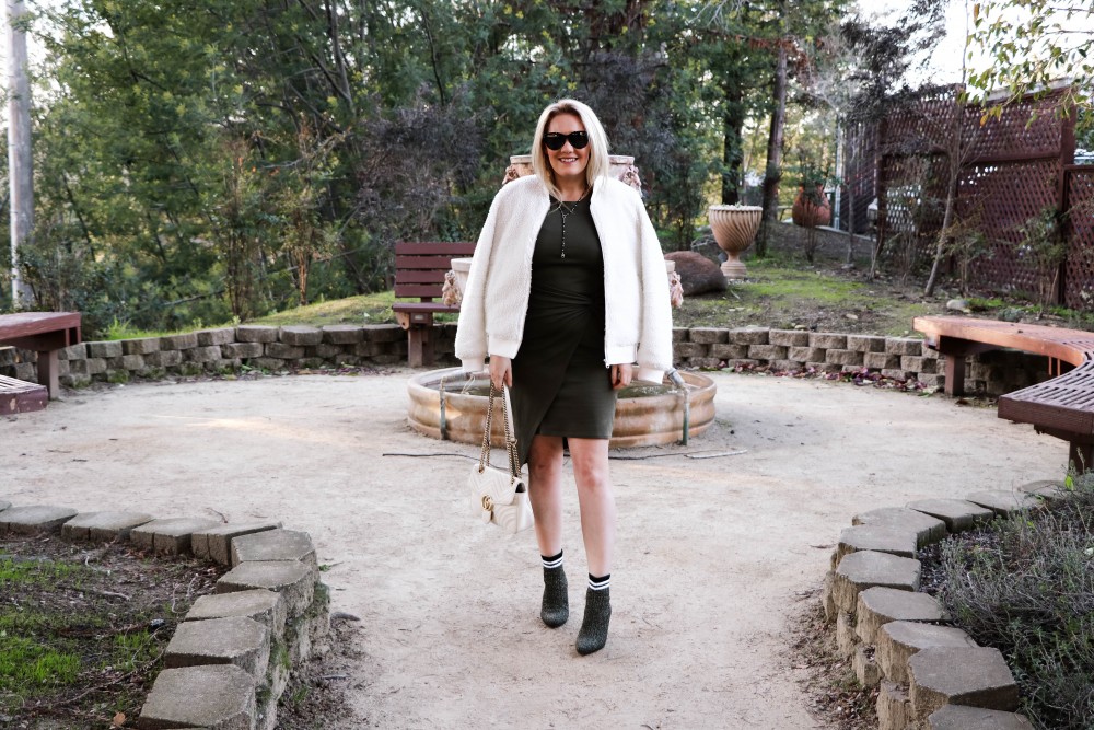 Varsity Style Wearing Fuzzy Bomber Jacket and Stripe Sock Booties | Have Need Want #varsitystyle #bomberjacket #sockbooties #casualstyle #stuartweitzman